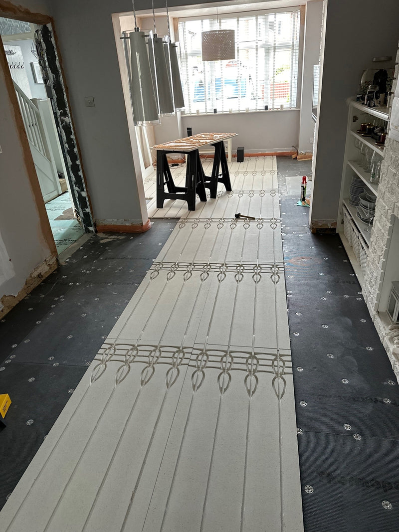 AD-SLIM grooved gypsum boards laid across an existing floor