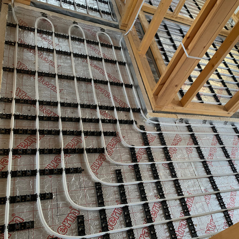 Grip rail retaining water underfloor heating pipe at planned centres
