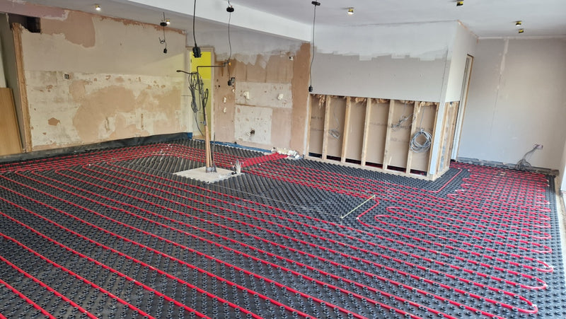 Wide overview of an AD-TRAY underfloor heating installation during a home renovation