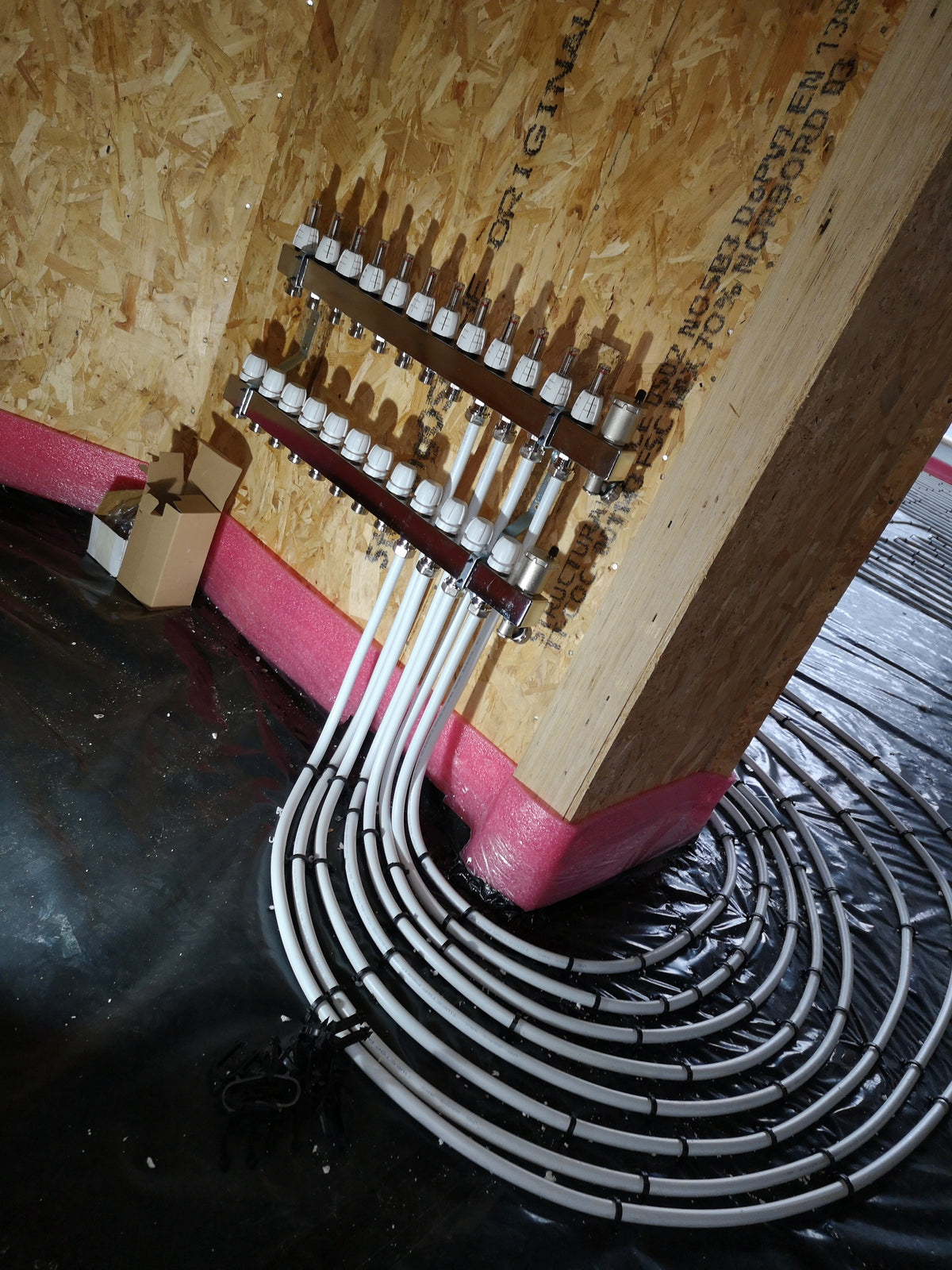 Two 12-port manifolds serving the ground and first floors